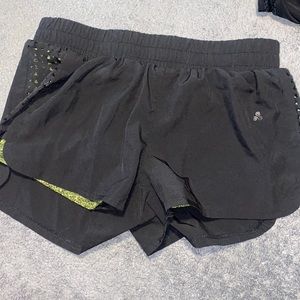 Athletic shorts with built in spandex. Woman’s M.